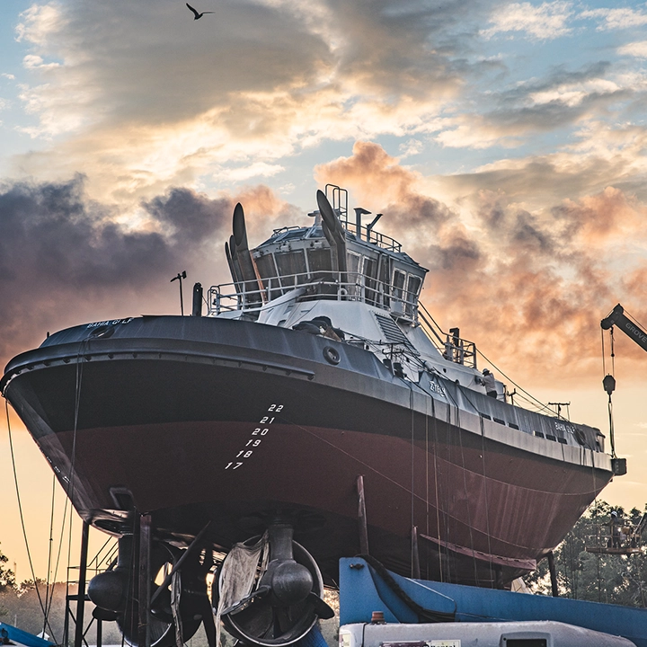 tugboat with sunrise in background