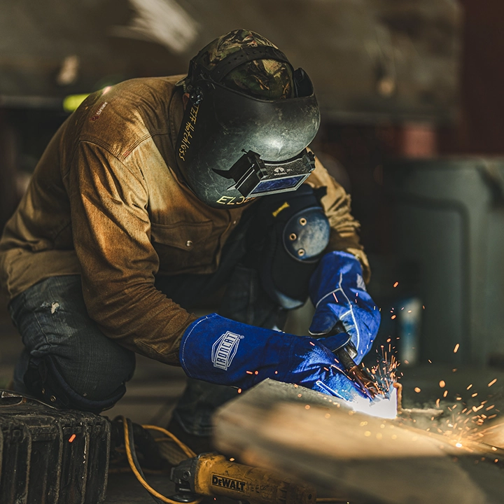 man welding with ppe on