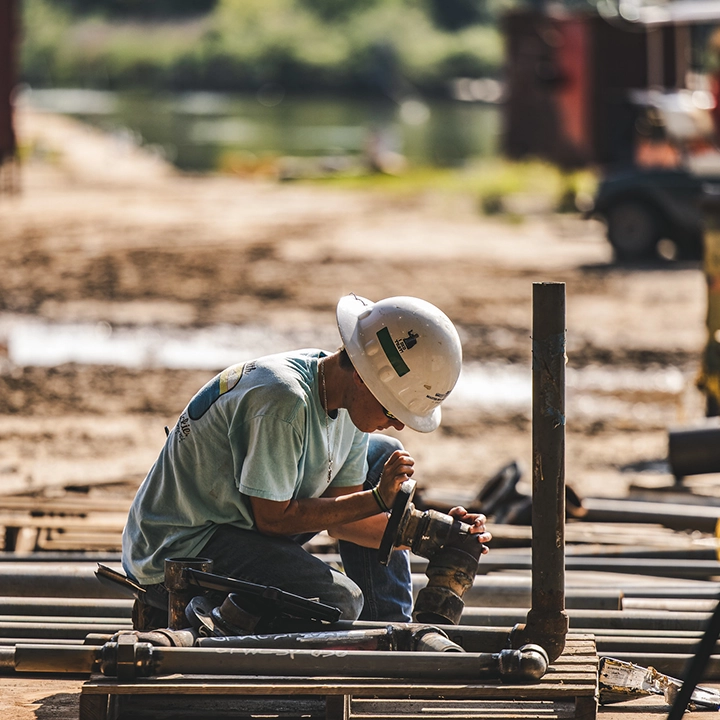 man working with pipe