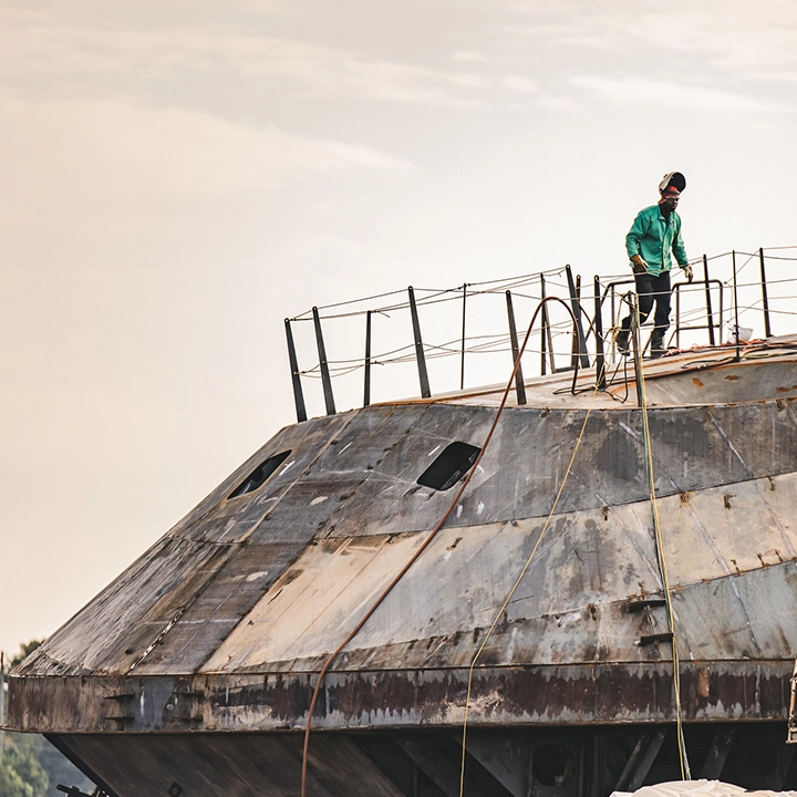 man standing on top of ship