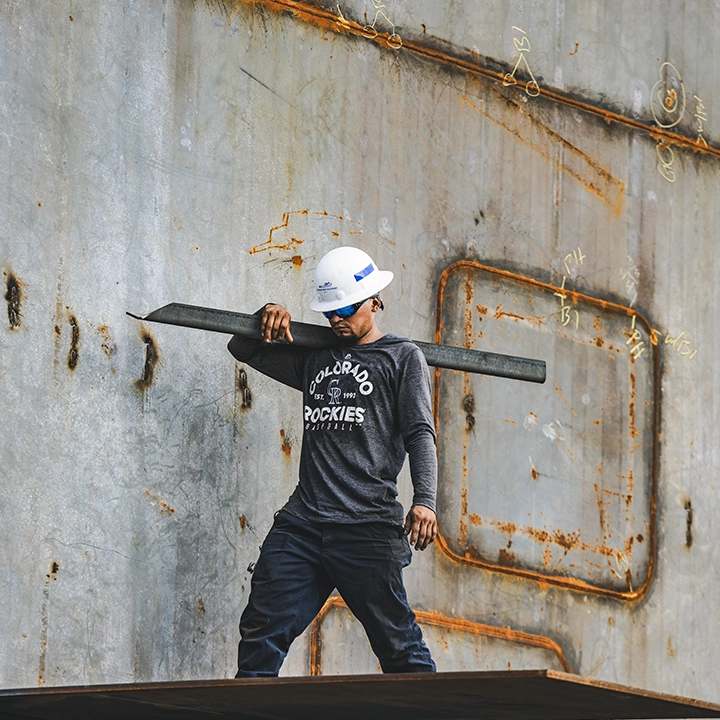 man carrying angle iron