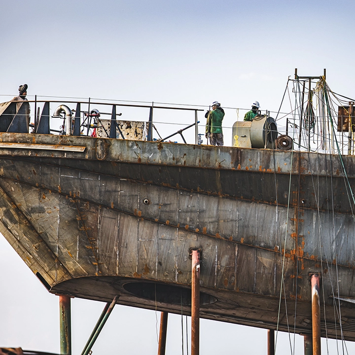 people working on elevated boat