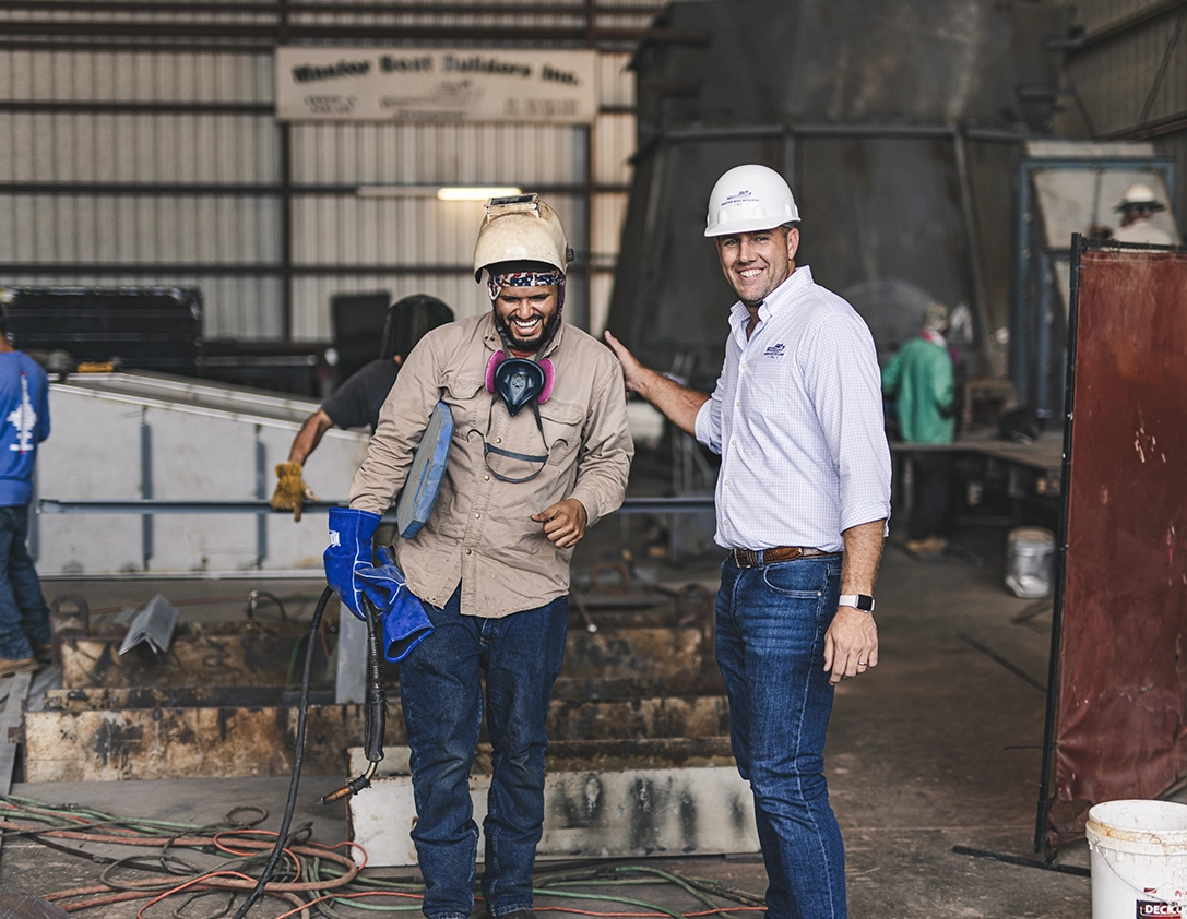 men laughing while working